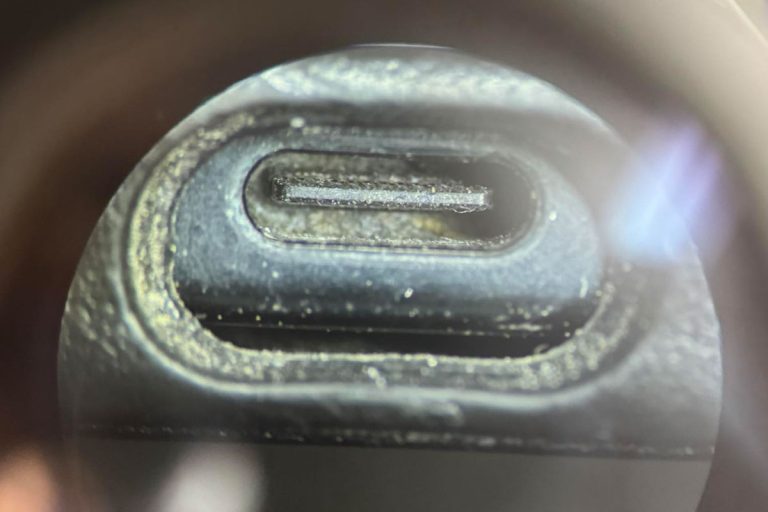 phone charging port with lint and dirt